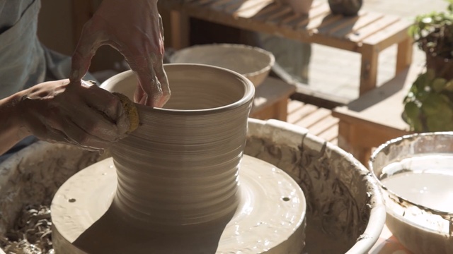 Video Reference: potter's wheel, tableware, pottery, ceramic, material, table, Person