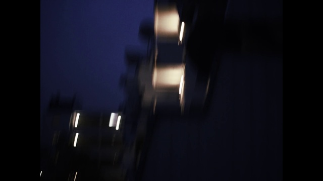 Video Reference: Black, Darkness, Light, Lighting, Sky, Night, Light fixture, Street light, Atmosphere, Architecture