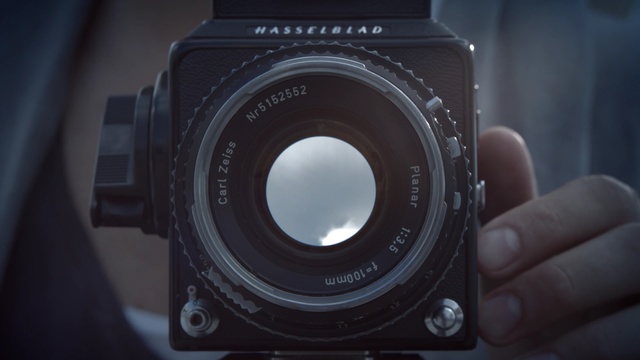 Video Reference: camera, aperture, reflex camera, equipment, regulator, photographic equipment, mechanism, lens, control, technology, speaker, shutter, music, audio, black, sound, bass, stereo, photography, Person