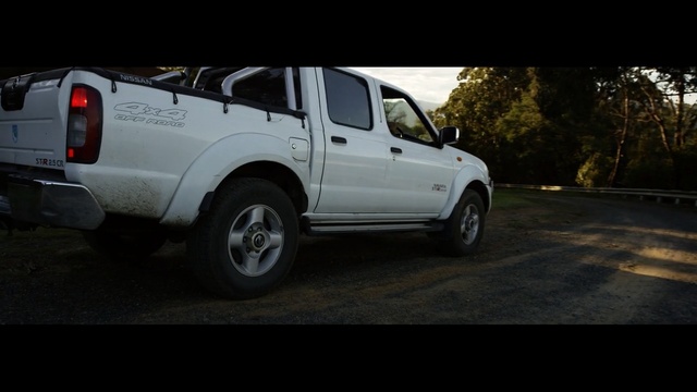 Video Reference: land vehicle, car, motor vehicle, vehicle, automotive tire, tire, off roading, mode of transport, rim, road, Person