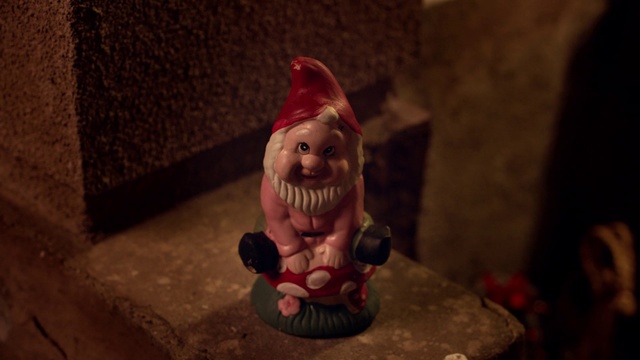 Video Reference: Garden gnome, Lawn ornament, Statue, Lighting, Figurine, Christmas, Monument, Animation, Interior design, Fictional character