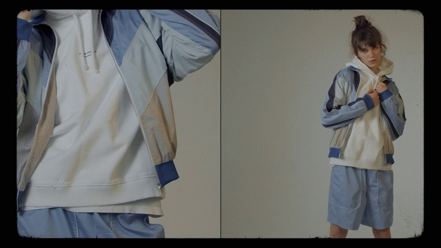 Video Reference: Outerwear, White, Dress shirt, Neck, Street fashion, Sleeve, Textile, Gesture, Jersey, Grey