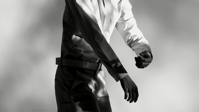 Video Reference: White, Black, Standing, Black-and-white, Male, Monochrome photography, Monochrome, Photography, Outerwear, Hand