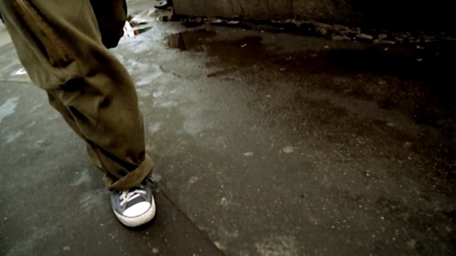Video Reference: Asphalt, Floor, Road surface, Flooring, Footwear, Leg, Shoe, Automotive wheel system, Longboard, Automotive tire