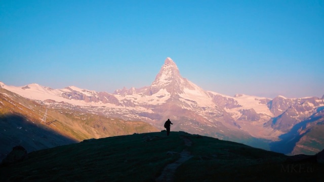 Video Reference: mountainous landforms, mountain range, sky, mountain, ridge, mount scenery, alps, massif, arête, morning, Person