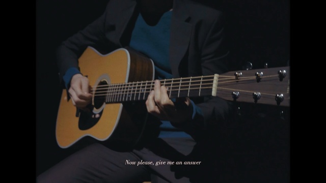 Video Reference: guitar, guitarist, musical instrument, string instrument, bass guitar, string instrument accessory, acoustic guitar, bassist, string instrument, plucked string instruments, Person