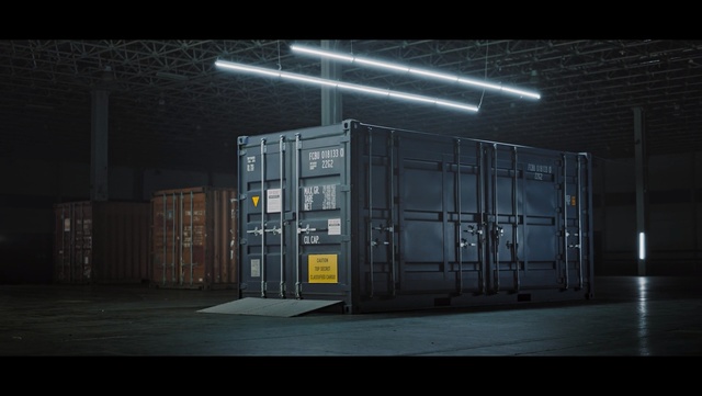 Video Reference: Darkness, Architecture, Building, Screenshot, Ceiling, Large, Night, Sitting, Station, Dark, Light, Table, Room, Standing, Street, City, Computer, White, Door, Platform, Parked, Parking, Man, Clock, Train, Bus, Sign, Tall