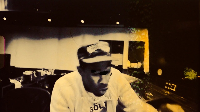 Video Reference: night, audio, technology, facial hair, fun, darkness, electronic device, music, event, Person