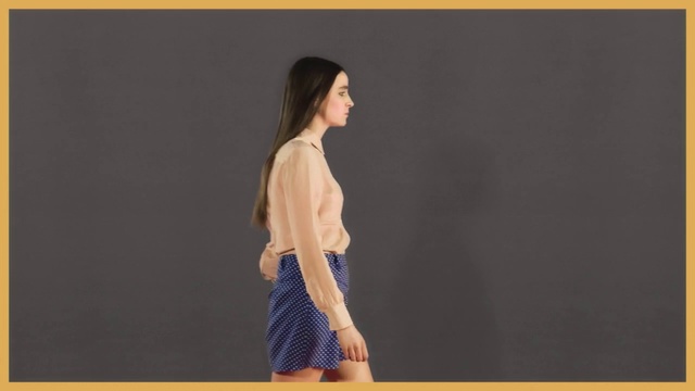 Video Reference: Clothing, Shoulder, Yellow, Fashion, Joint, Neck, Outerwear, Dress, Sleeve, Leg, Person, Woman, Standing, Young, Looking, Holding, Girl, Front, Female, Lady, Racket, Shirt, Court, Playing, Monitor, Black, Man, Wearing, Screen, Television, Player, Walking, White, Ball, Room, Text, Human face, Skirt, Fashion model, Day dress, Miniskirt, Waist, Fashion design