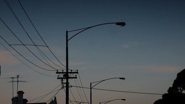 Video Reference: Sky, Overhead power line, Wire, Street light, Electricity, Lighting, Light fixture, Electrical supply, Line, Electrical wiring, Person