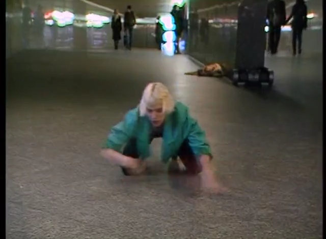 Video Reference: Green, Floor, Photograph, Flooring, Snapshot, Fun, Sitting, Standing, Asphalt, Male, Person