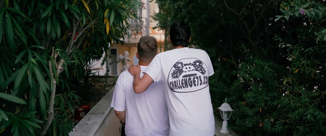 Video Reference: Photograph, T-shirt, Shoulder, Fun, Cool, Top, Photography, Outdoor, Person, Grass, Man, Standing, Young, Holding, Boy, Board, Shirt, Little, Wearing, Street, White, Playing, Food, Pizza, Tree, Clothing