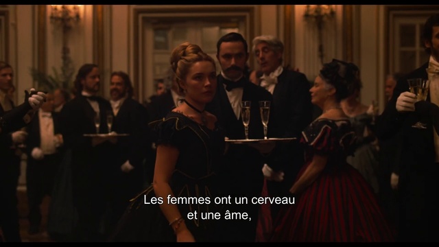 Video Reference: Photograph, Event, Fashion, Adaptation, Dress, Performance, Photo caption, Gentleman, Audience, Screenshot, Person, Indoor, Man, Photo, Standing, Group, Looking, People, Front, Holding, Woman, Mirror, Room, Table, Young, Teeth, Large, Video, Brushing, Playing, Human face, Clothing, Smile, Crowd