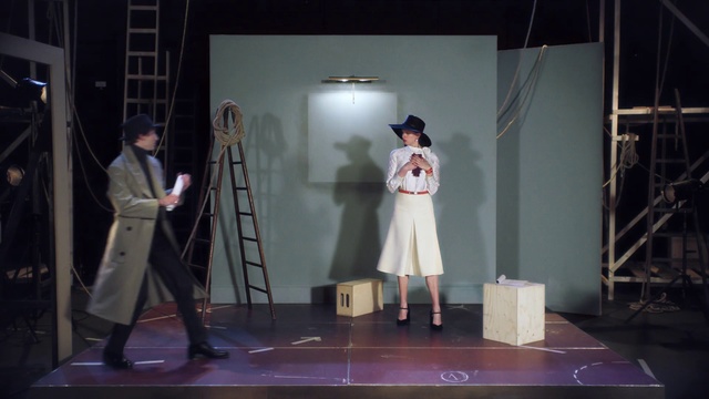 Video Reference: Heater, Drama, Performance, Performing arts, Stage, Scene, Theatrical property, Performance art, Acting, Theatrical scenery, Indoor, Person, Standing, Man, Room, Table, Playing, Holding, Living, Woman, Game, Video, Wearing, Young, People, Wii, Group, White, Remote, Floor, Clothing