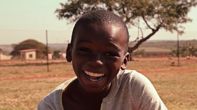 Video Reference: Face, People, Smile, Facial expression, Forehead, Child, Head, Skin, Adaptation, Male