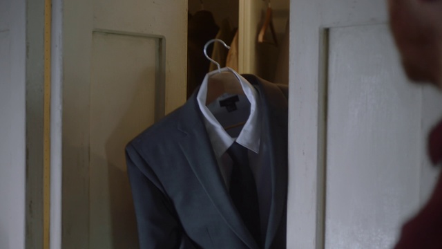 Video Reference: Suit, Clothing, Formal wear, Outerwear, Tuxedo, Blazer, Room, Clothes hanger, Dress, Jacket