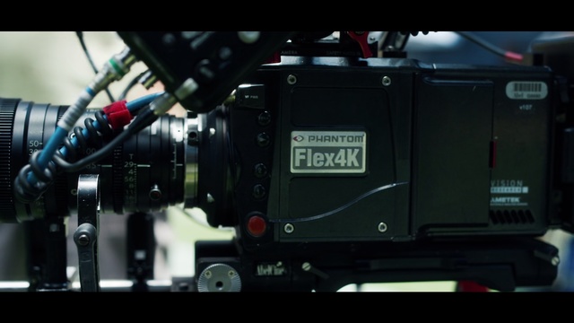Video Reference: Transport, Camera, Cameras & optics, Vehicle, Auto part, Machine, Technology, Engine, Photography, Electronics, Front, Sitting, Black, Large, White, Standing, Man, Street, Table, Red, Baseball, Room, Bus, Blue, Projector
