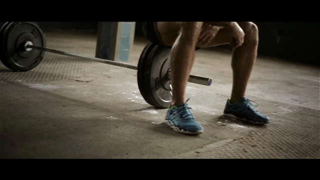 Video Reference: exercise equipment, leg, footwear, human leg, barbell, calf, joint, physical fitness, arm, muscle, Person