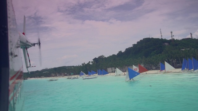 Video Reference: waterway, sailing, coastal and oceanic landforms, sail, sailing, sailboat, water transportation, boat, water, sky, Person