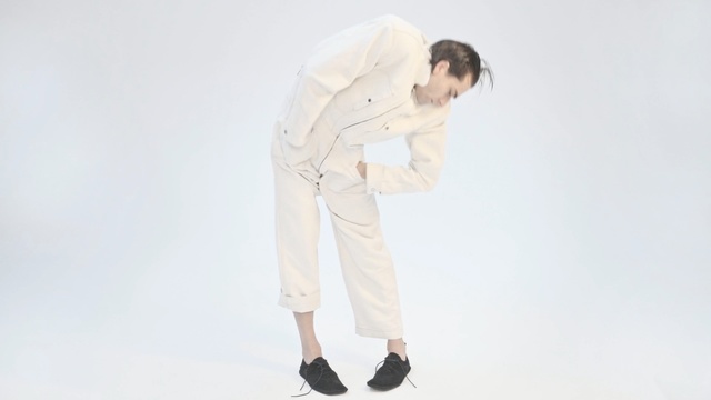 Video Reference: White, Clothing, Standing, Trousers, Shoulder, Sportswear, Outerwear, Leg, Sleeve, Neck