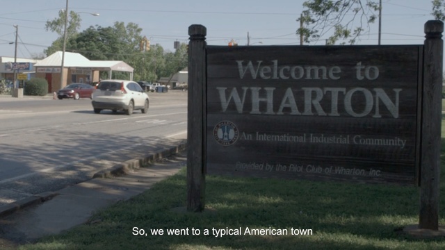 Video Reference: vehicle, signage, car, sign, area, advertising, road, tree, land lot, landscape