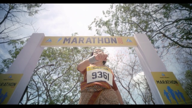 Video Reference: Tree, Advertising, Endurance sports, Signage, Recreation, Half marathon, Triathlon, Font, Banner, Duathlon