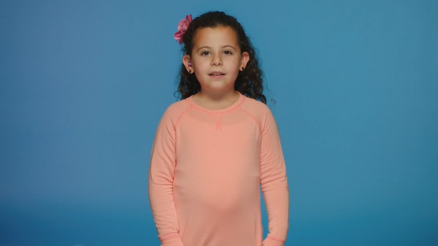 Video Reference: blue, pink, beauty, shoulder, girl, standing, fun, t shirt, smile, outerwear, Person