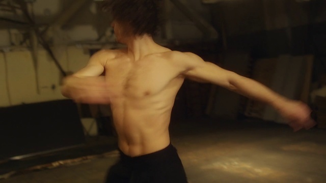 Video Reference: Barechested, Muscle, Shoulder, Arm, Male, Back, Chest, Joint, Human body, Abdomen, Person, Indoor, Man, Young, Front, Holding, Standing, Woman, Wearing, Shirt, Phone, Room, Kitchen, Blurry, Bed, Wall, Shirtless, Nude, Stomach, Bodybuilder, Undergarment, Bodybuilding, Briefs, Chest hair, Flesh, Underpants, Trunk, Navel, Guy, Elbow, Physical fitness, Dance, Tattoo