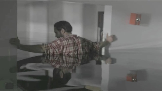 Video Reference: mode of transport, room, structure, wall, lighting, facial hair, arm, interior design, muscle, glass