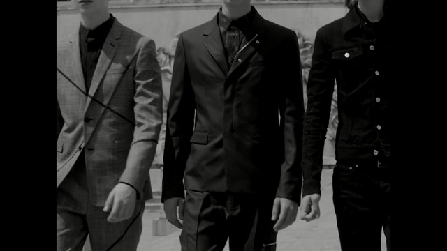 Video Reference: suit, garment, businessman, man, clothing, business, corporate, jacket, male, executive, success, person, professional, confident, office, adult, people, covering, consumer goods, handsome, standing, successful