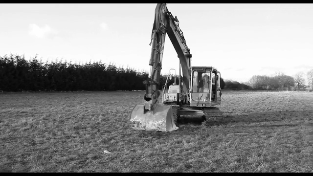 Video Reference: black and white, tree, monochrome photography, monochrome, sky, vehicle, grass, asphalt, automotive tire, landscape