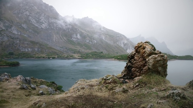 Video Reference: Mountainous landforms, Highland, Mountain, Atmospheric phenomenon, Natural landscape, Fjord, Lake, Wilderness, Mountain range, Water