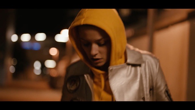 Video Reference: Face, Yellow, Head, Human, Photography, Night, Outerwear, Headgear, Street, Darkness, Person