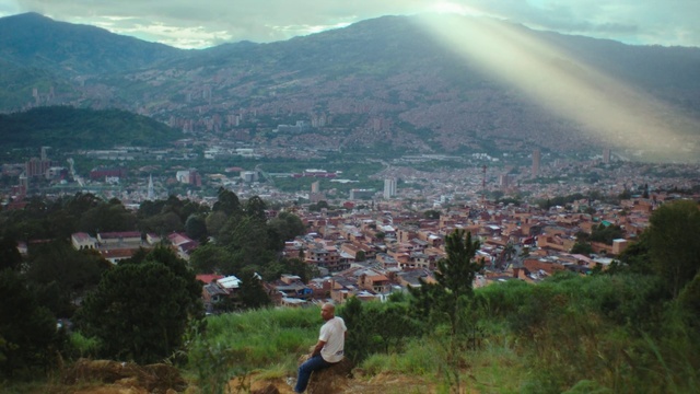 Video Reference: Hill station, Mountainous landforms, Highland, Hill, Mountain village, Mountain, Human settlement, Town, Sky, Village