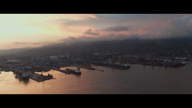 Video Reference: Sky, Aerial photography, Water resources, Cloud, Water, River, Horizon, Atmospheric phenomenon, Evening, Morning, Outdoor, Mountain, Boat, Sunset, View, Clouds, Cloudy, Large, Flying, Plane, Body, Sun, Airplane, Man, City, Snow, Hill, Air, Skiing, Group, Riding, Lake, Ship, Landscape, Nature, Travel, Watercraft, Shore