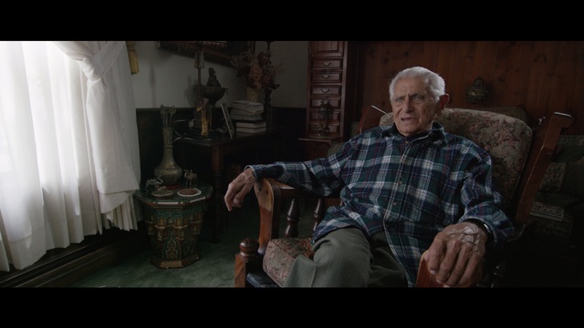 Video Reference: screenshot, sitting, darkness, midnight, Person