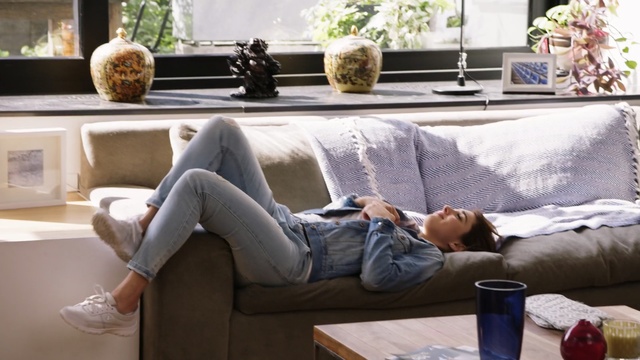 Video Reference: furniture, couch, room, living room, interior design, home, table, window, product, angle, Person