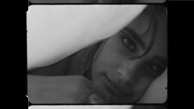 Video Reference: Face, Photograph, Nose, Black-and-white, Head, Eyebrow, Portrait, Eye, Forehead, Monochrome photography, Person, Indoor, Man, Looking, Laptop, Photo, Computer, Young, Glasses, Sitting, Wearing, Boy, Woman, Mirror, White, Pizza, Hat, Bed, Human face, Black and white, Eyes, Baby, Selfie