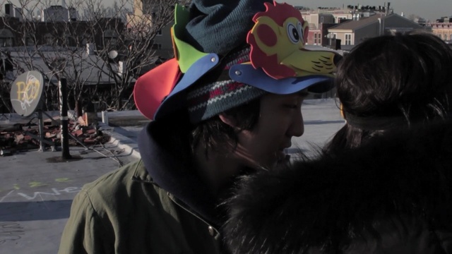 Video Reference: event, headgear, tree, product, crowd, vehicle, winter, fun, street, recreation