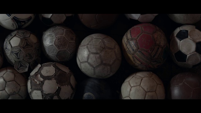 Video Reference: Ball, Football, Soccer ball, Still life photography, Symmetry, Sphere, Sports equipment, Art, Darkness