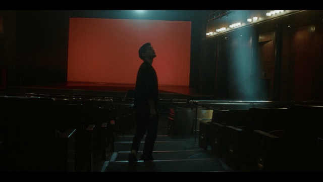 Video Reference: Darkness, Standing, Photography, Sky, Backlighting, Room, Screenshot, Digital compositing, Shadow, Performance