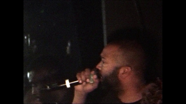 Video Reference: Nose, Head, Music, Singer, Darkness, Mouth, Singing, Facial hair, Photography, Smoking