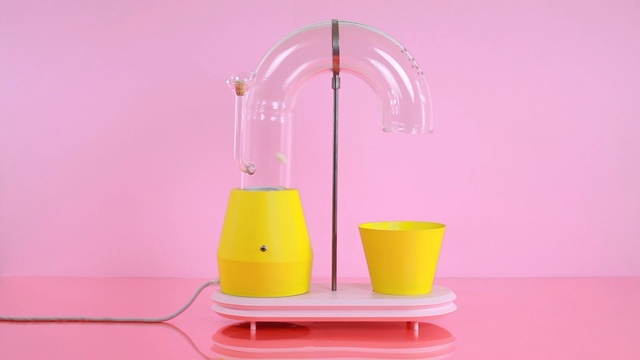 Video Reference: pink, yellow, product, product, small appliance, Person