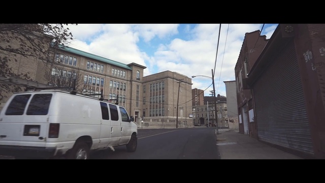 Video Reference: Car, Sky, Vehicle, Town, Urban area, Luxury vehicle, Transport, Snapshot, Mode of transport, Street