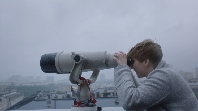 Video Reference: kid, teen, teenager, lookout, roof, city, town, cold