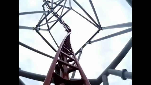 Video Reference: ferris wheel, structure, tourist attraction, amusement ride, sky, roller coaster, electrical supply, recreation, line, electricity, Person