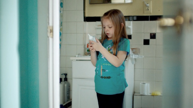 Video Reference: blue, clothing, room, shoulder, standing, girl, textile, fun, joint, house, Person