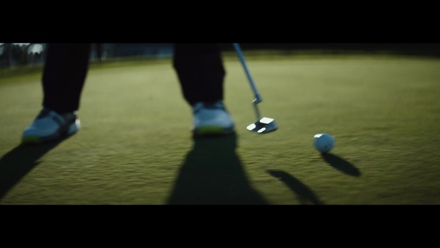 Video Reference: player, blue, green, putter, grass, ball, football, atmosphere, ball, golf equipment