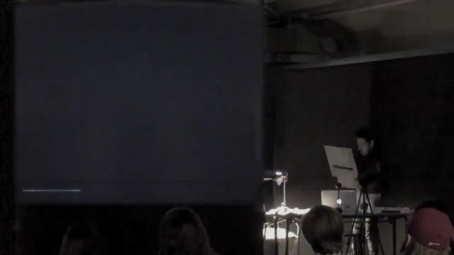 Video Reference: stage, entertainment, musical instrument accessory, performance, sound, darkness, musical instrument, lecture, projection screen, performance art