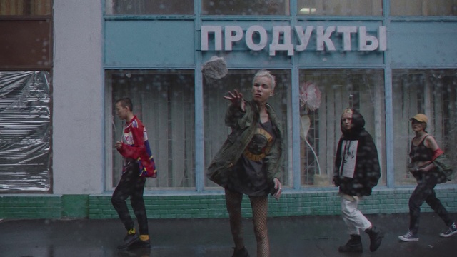 Video Reference: Pedestrian, Person, Building, Outdoor, Playing, Man, Walking, Woman, Girl, Holding, Street, Young, Riding, Green, Group, Ball, People, Game, Standing, City, Court, Jumping, Soccer, Player, Field, Clothing, Text, Footwear